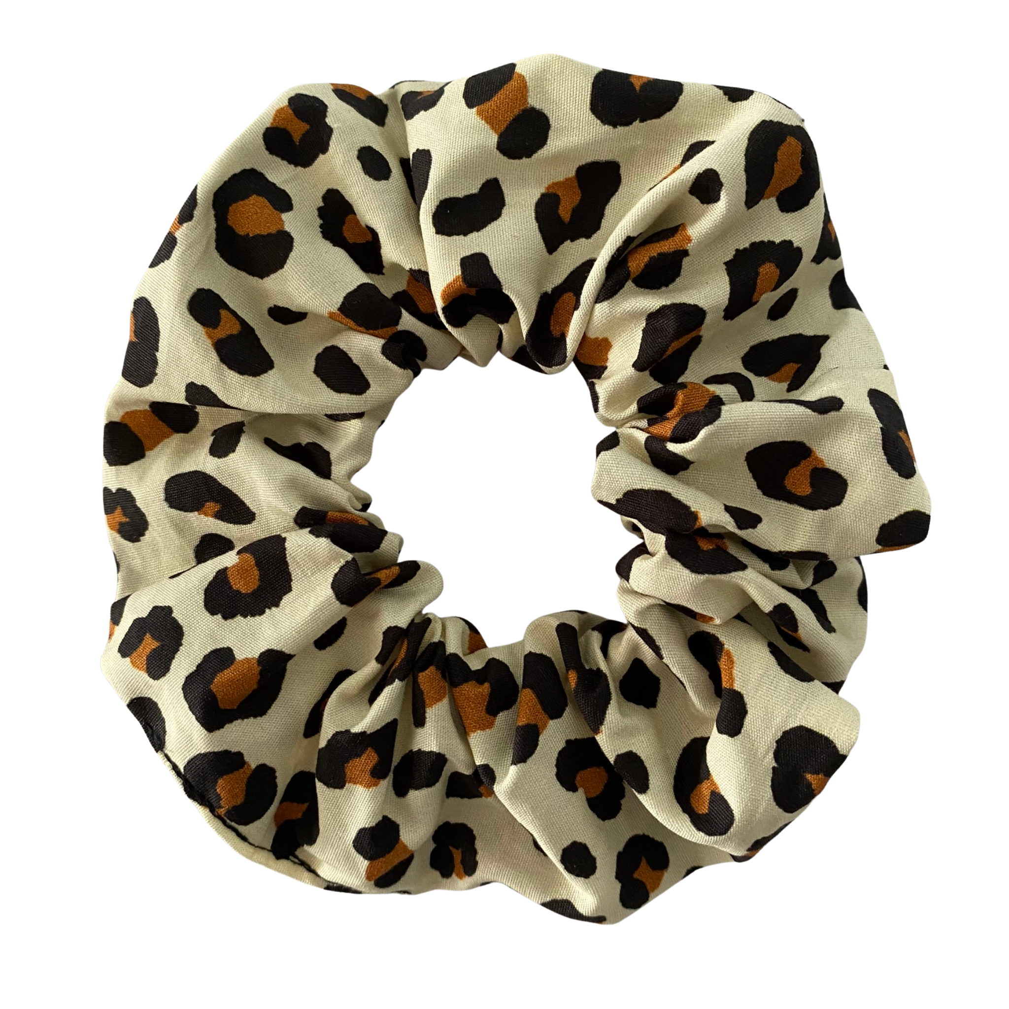 Leopard print scrunchie on a cream background.
