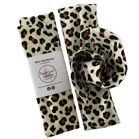 Leopard print headband with packaging on a white background.