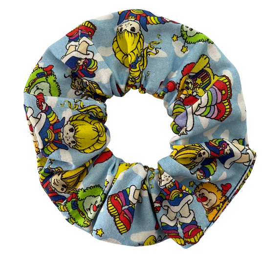 Colourful scrunchie with Rainbow Brite character design on a white background.