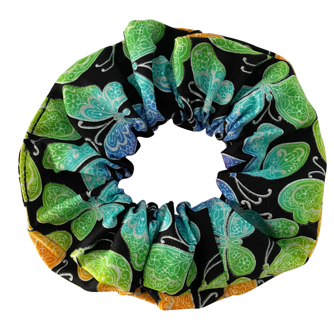 Scrunchie with butterfly pattern on a black background.