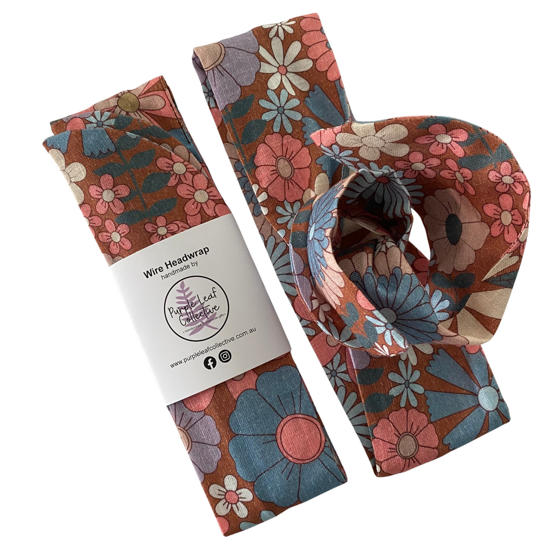 Floral wire headwrap with packaging on a white background.