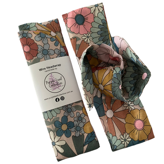 Floral wire headwrap with packaging on a white background.