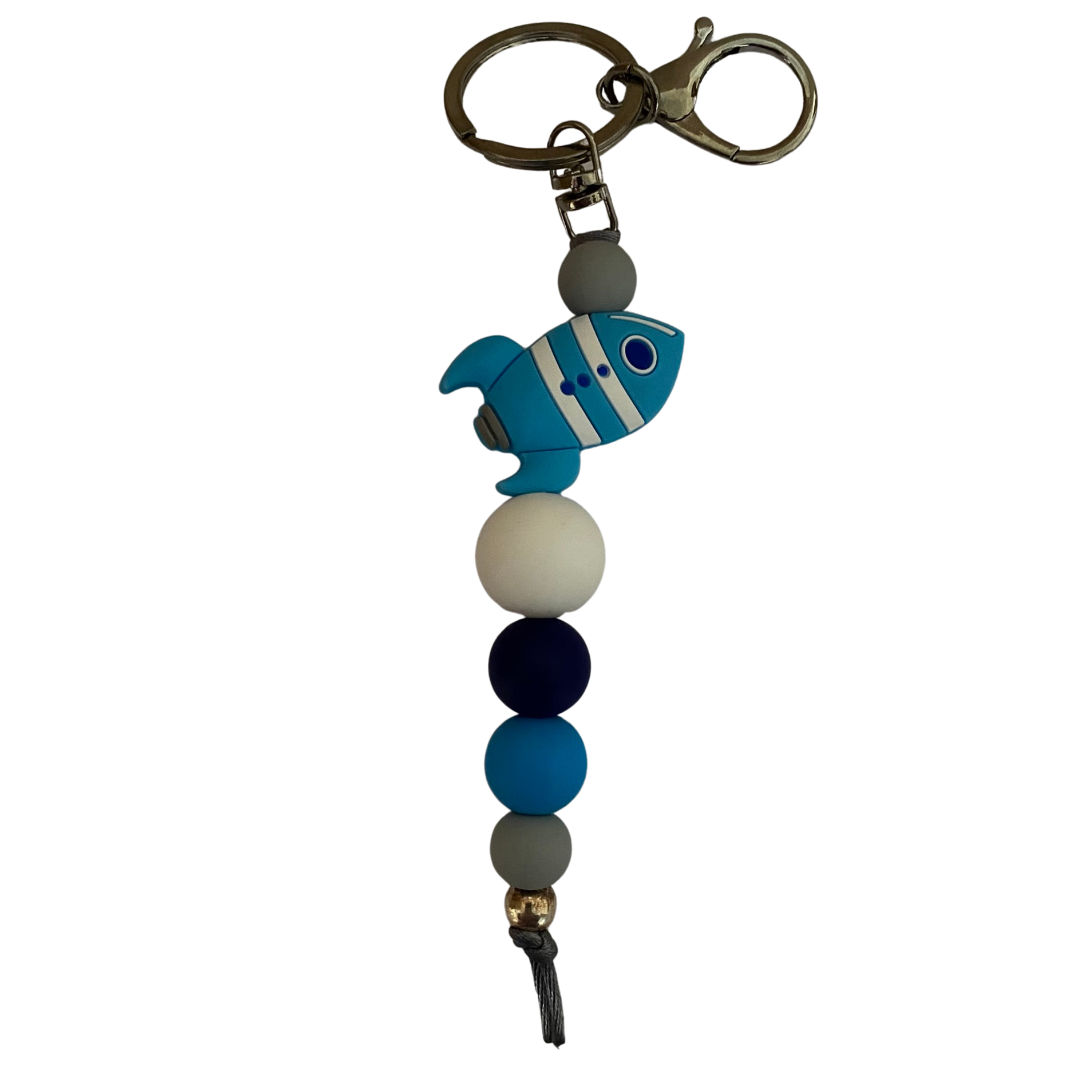 An 18cm keyring featuring a blue rocket ship and other coloured silicone beads.