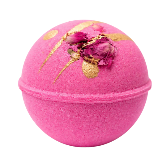Pink bath bomb topped with gold glitter and rosebuds.