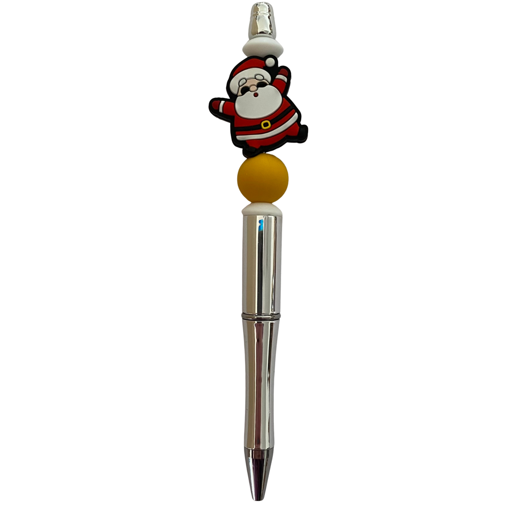 Pen with a Santa Claus design on top against a white background.