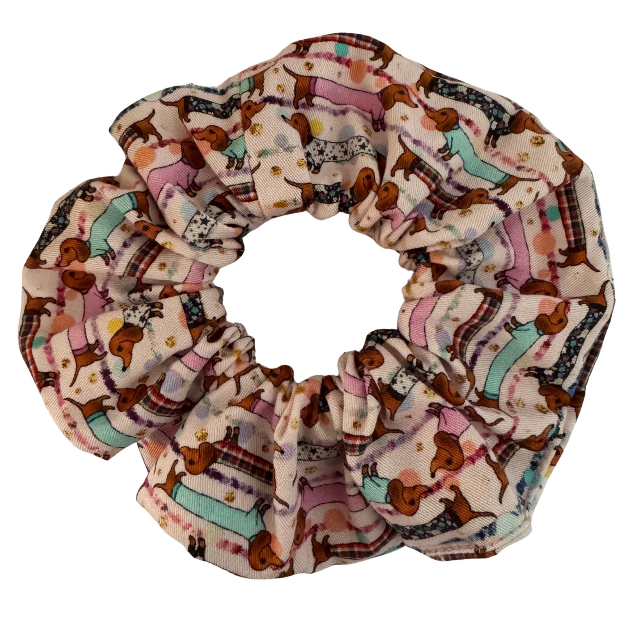 Our Sausage Dog Scrunchie featuring adorable dachshunds dressed in cute little coats.