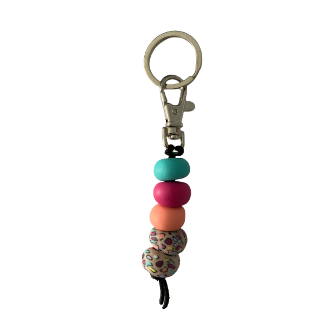 Handmade polymer clay keyring featuring five hand-rolled beads in apricot, raspberry, turquoise and multicoloured designs, attached to a silver clasp.