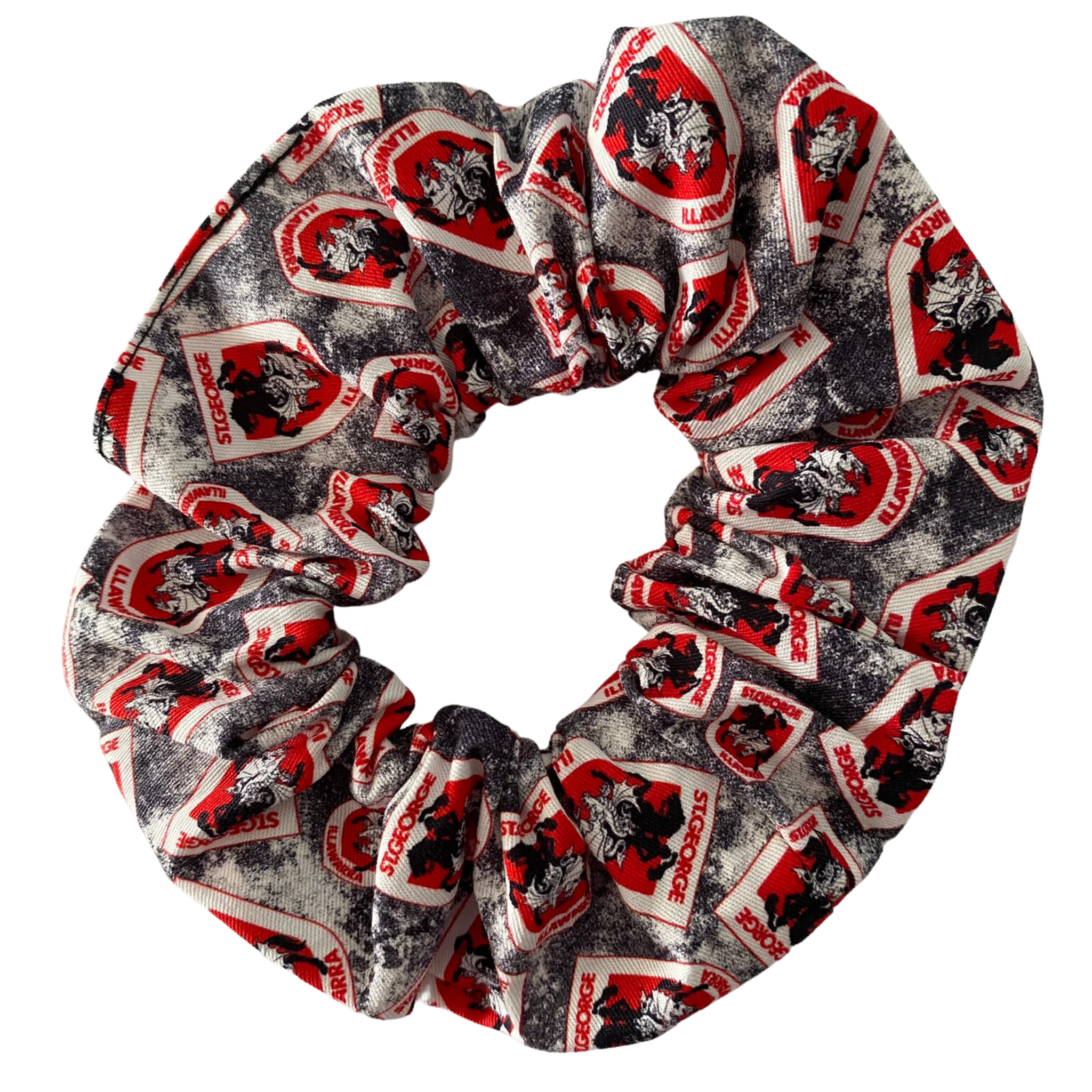 A scrunchie hair tie handmade with cotton woven fabric with images of the St George-Illawarra Dragons rugby league team.