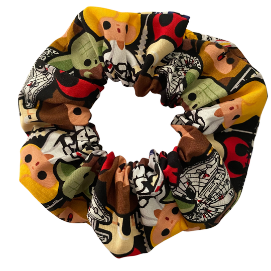 A black fabric scrunchie with images of all your favourite Star Wars characters.