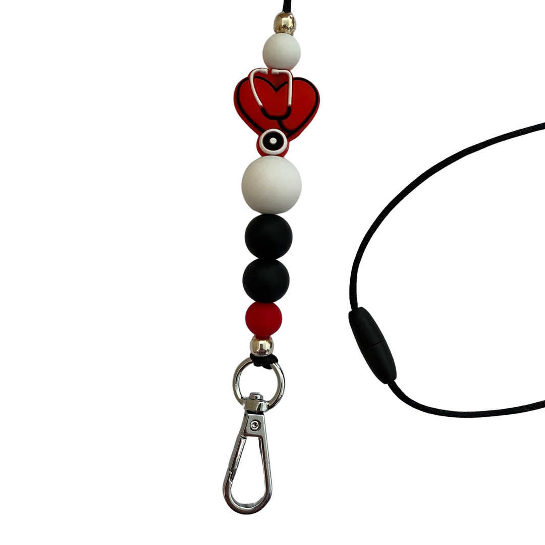 A 60cm lanyard fitted with a safety break away clasp and a Stethoscope Heart Red silicone bead and other coloured round silicone beads.