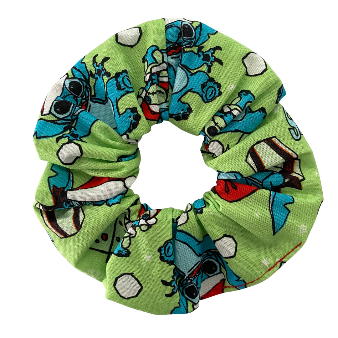 Green scrunchie with Stitch character pattern on a white background.