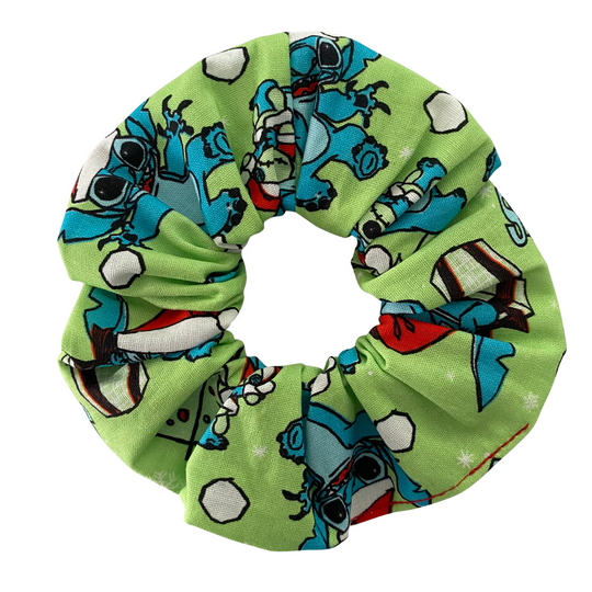Green scrunchie with Stitch character pattern on a white background.