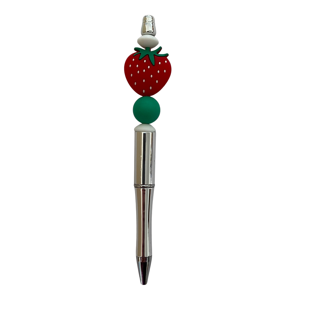 Pen with a strawberry-shaped top on a white background.