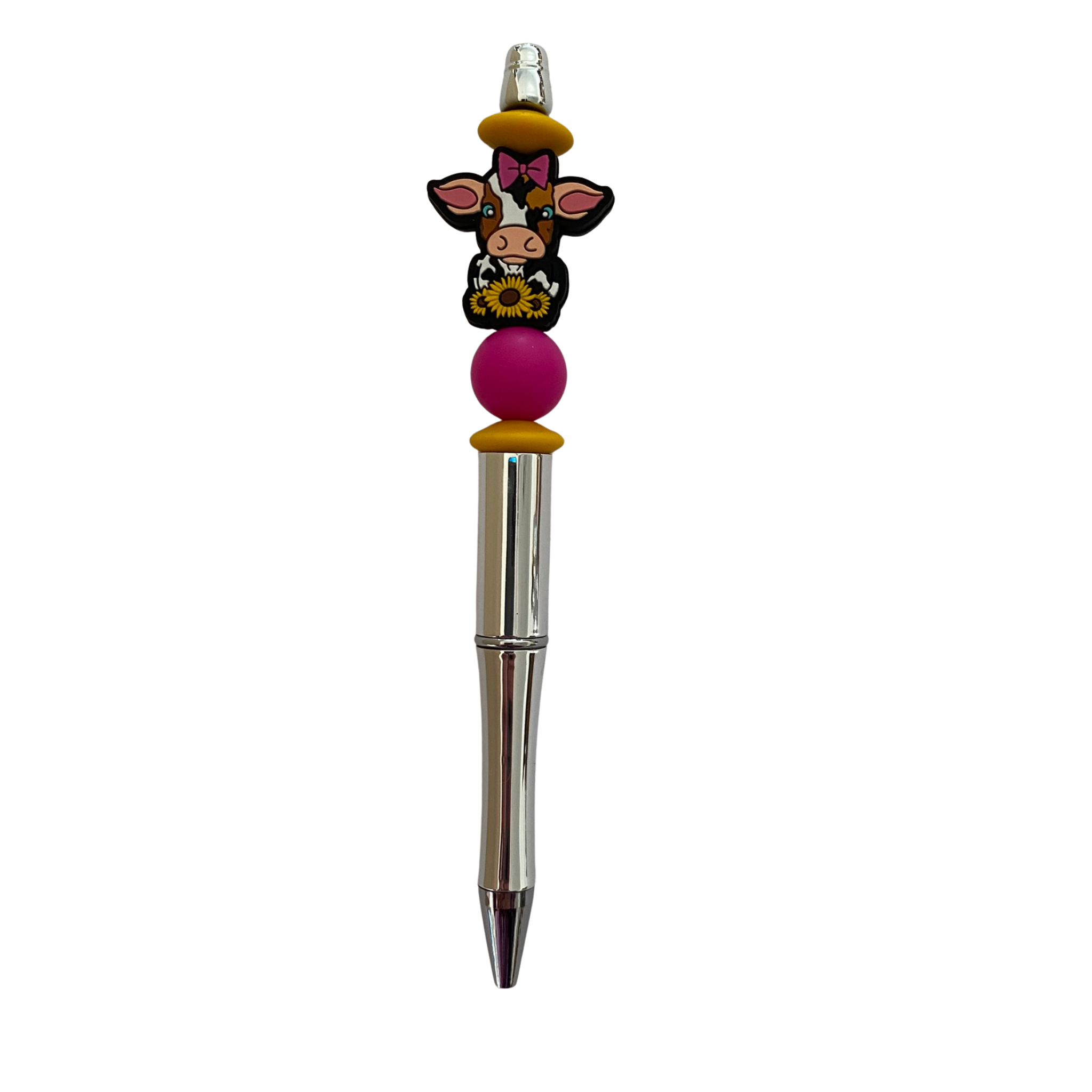 Pen with a sunflower cow silicone bead on top on a white background.
