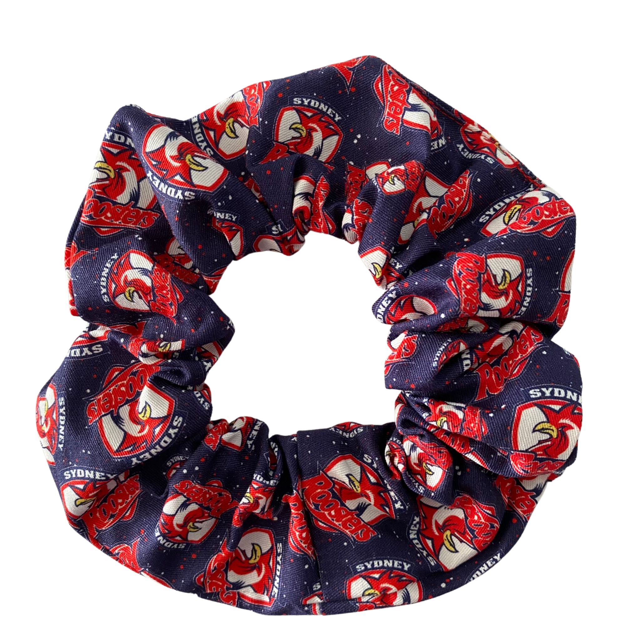 A scrunchie hair tie handmade with cotton woven fabric with images of the Sydney Roosters rugby league team.