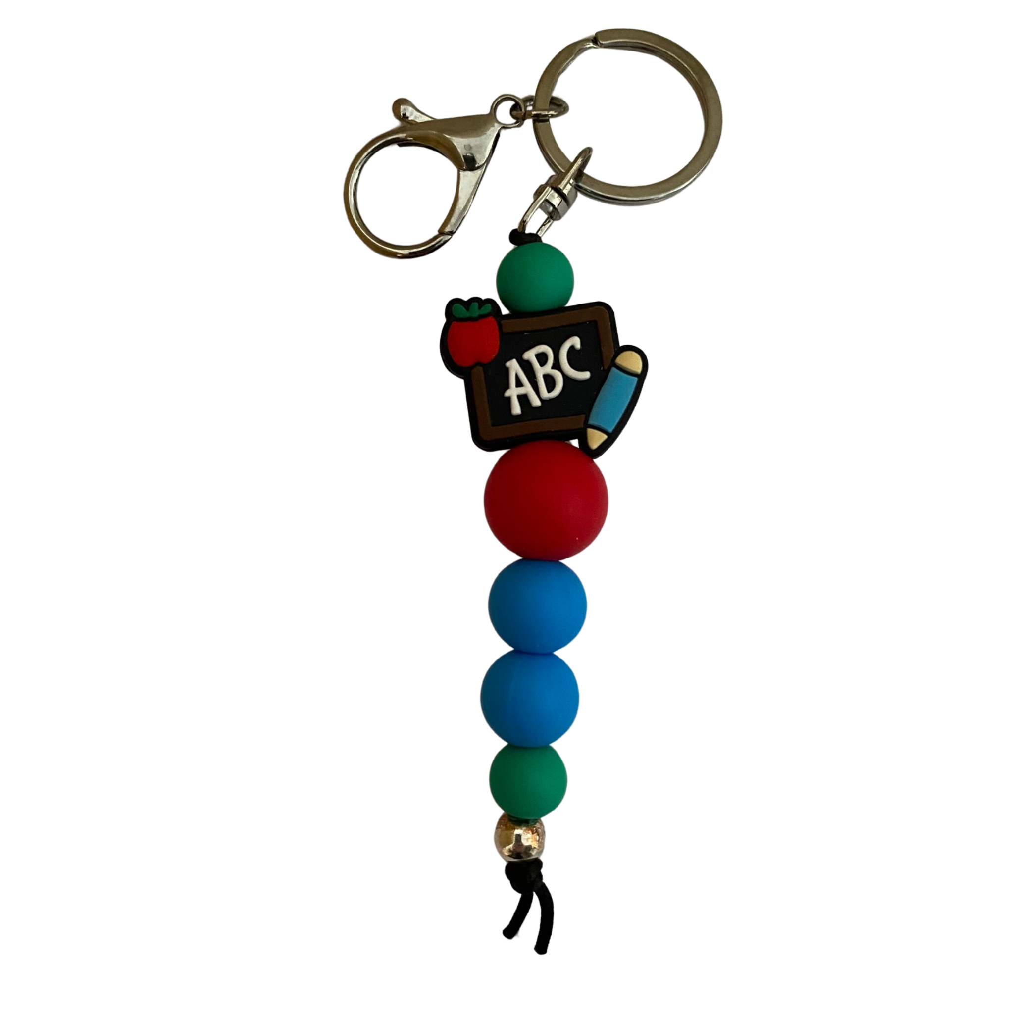 An 18cm keyring with a blackboard with the letters ABC and an apple and crayon and other silicone round beads.