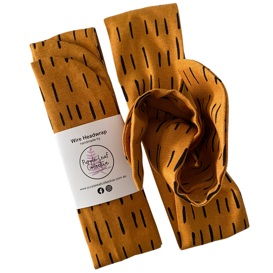 Tiger stripe headwrap with black pattern on a white background.