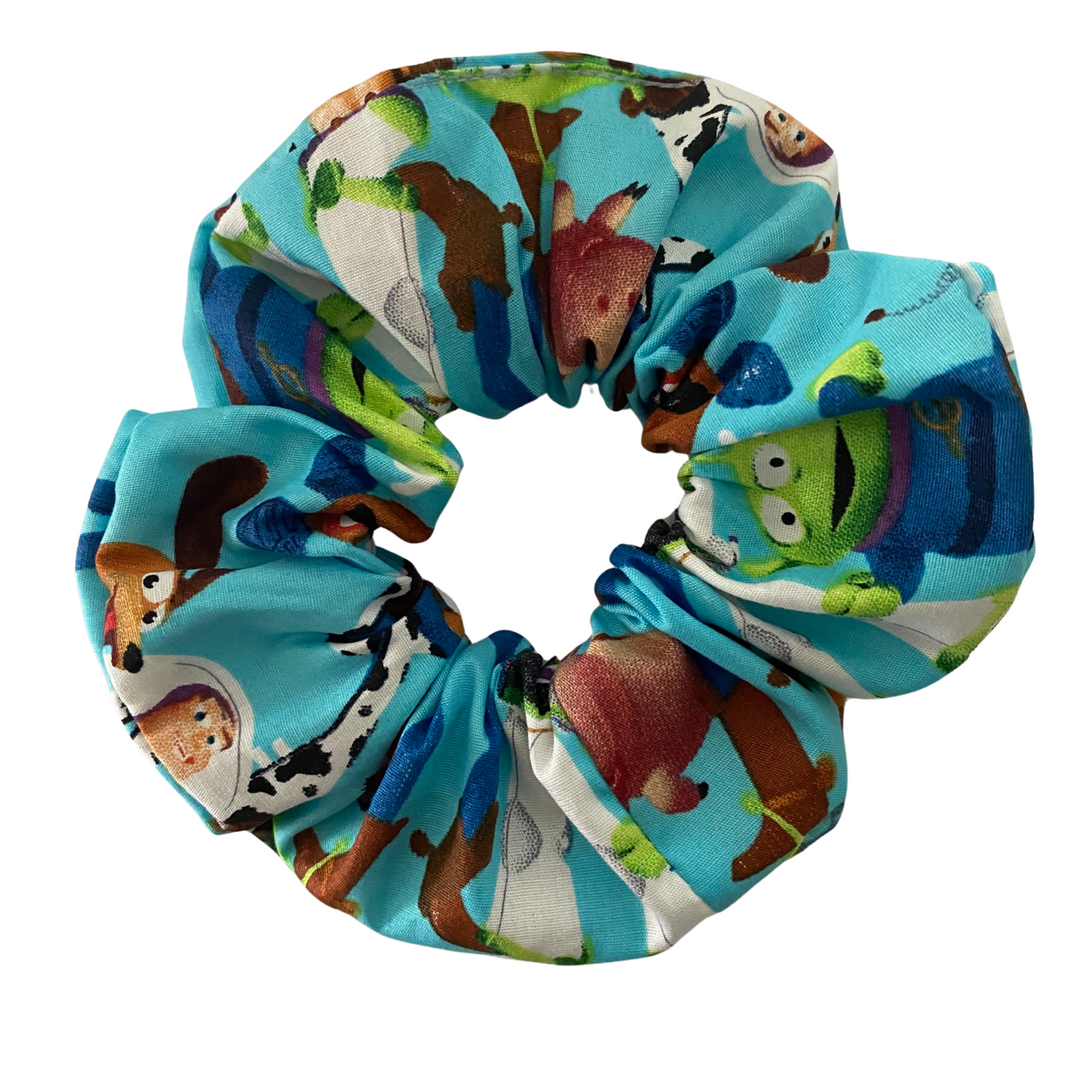 A fun Scrunchie featuring all your favourite Toy Story characters set on a blue ocean coloured fabric.