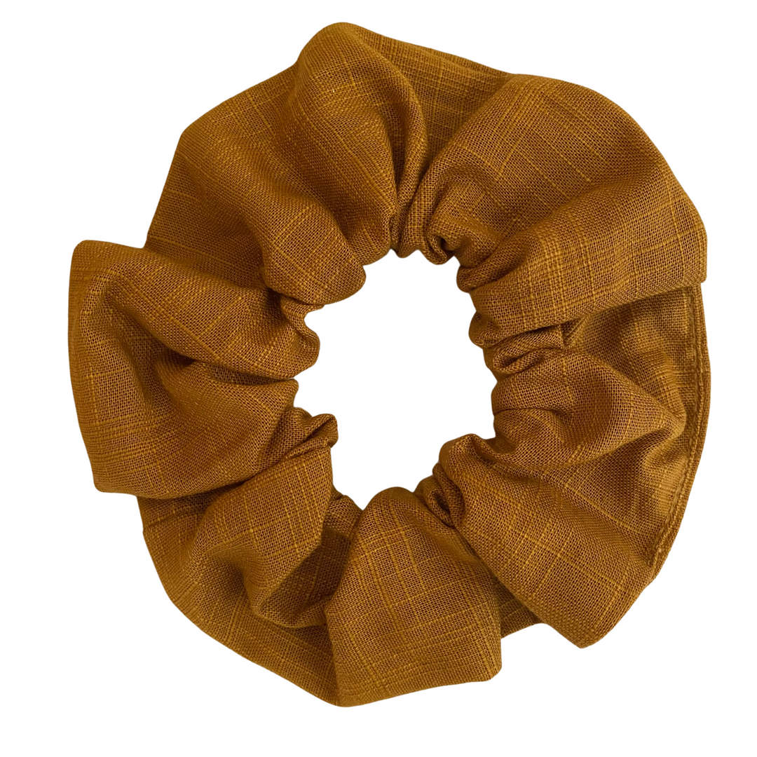Turmeric Linen Scrunchie is handmade from cotton woven fabric and features strong braided elastic.