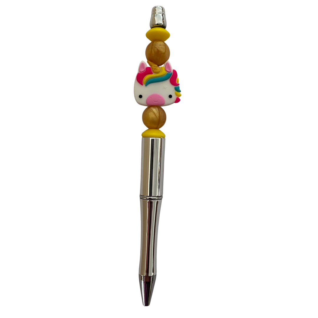 Pen with a cotton candy pink unicorn-shaped top on a white background.