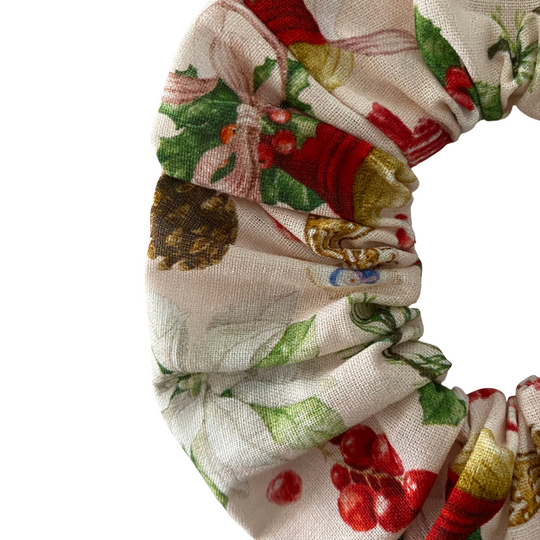 Scrunchie with festive pattern on a white background.