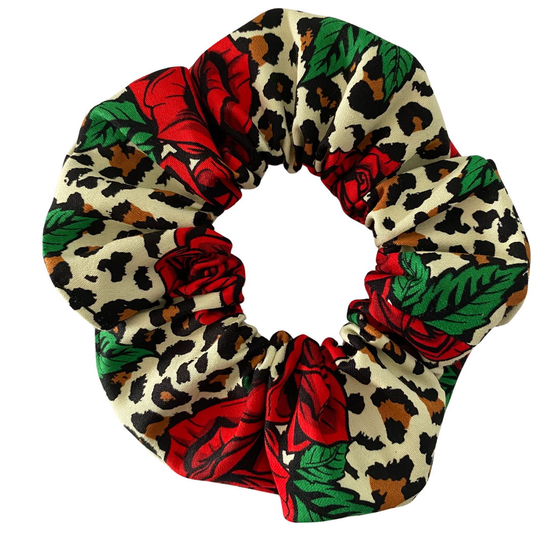 Wild Thing Scrunchie made from soft cotton sateen, featuring a bold red rose and leopard print design with durable braided elastic for secure hold.