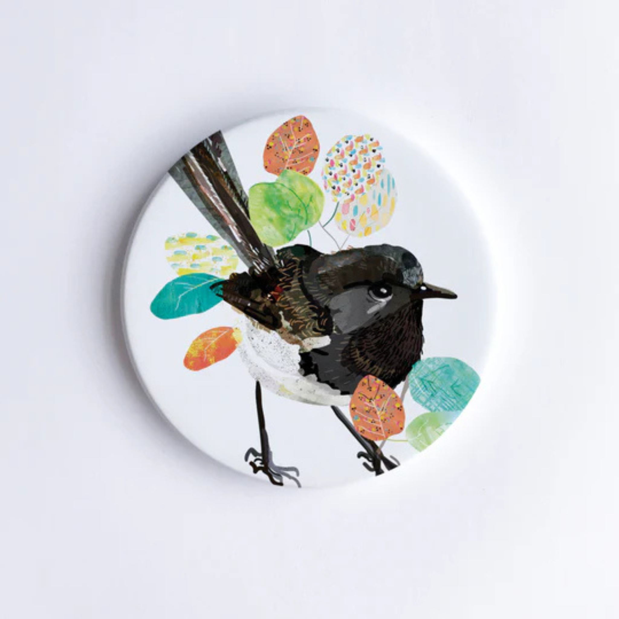 A 90mm diameter ceramic drink coaster featuring a picture of a Willie Wagtail.