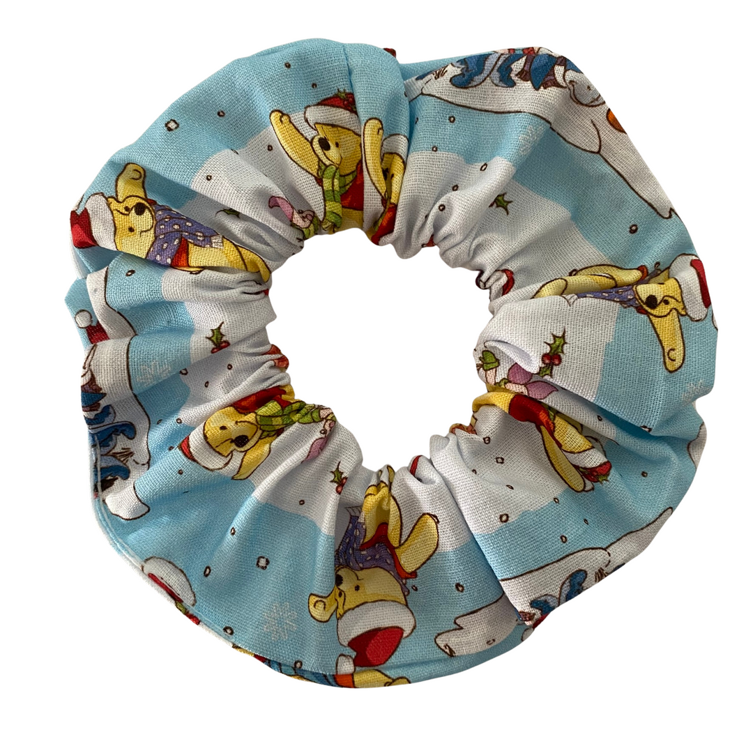Scrunchie with Winnie The Pooh characters pattern on a white background.
