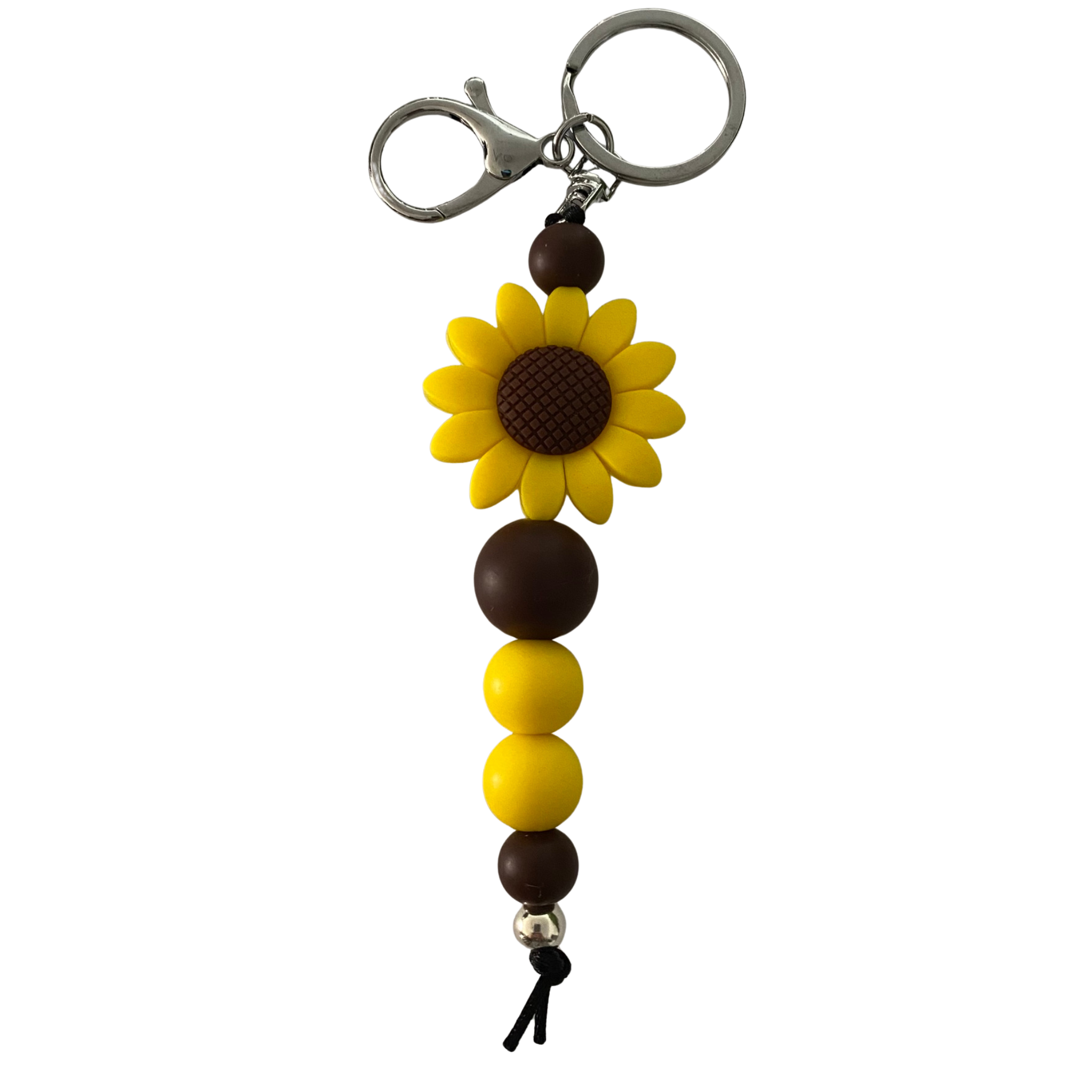 Keyring featuring yellow and brown silicone beads, a silver aluminium bead and a yellow sunflower charm on a black nylon cord.